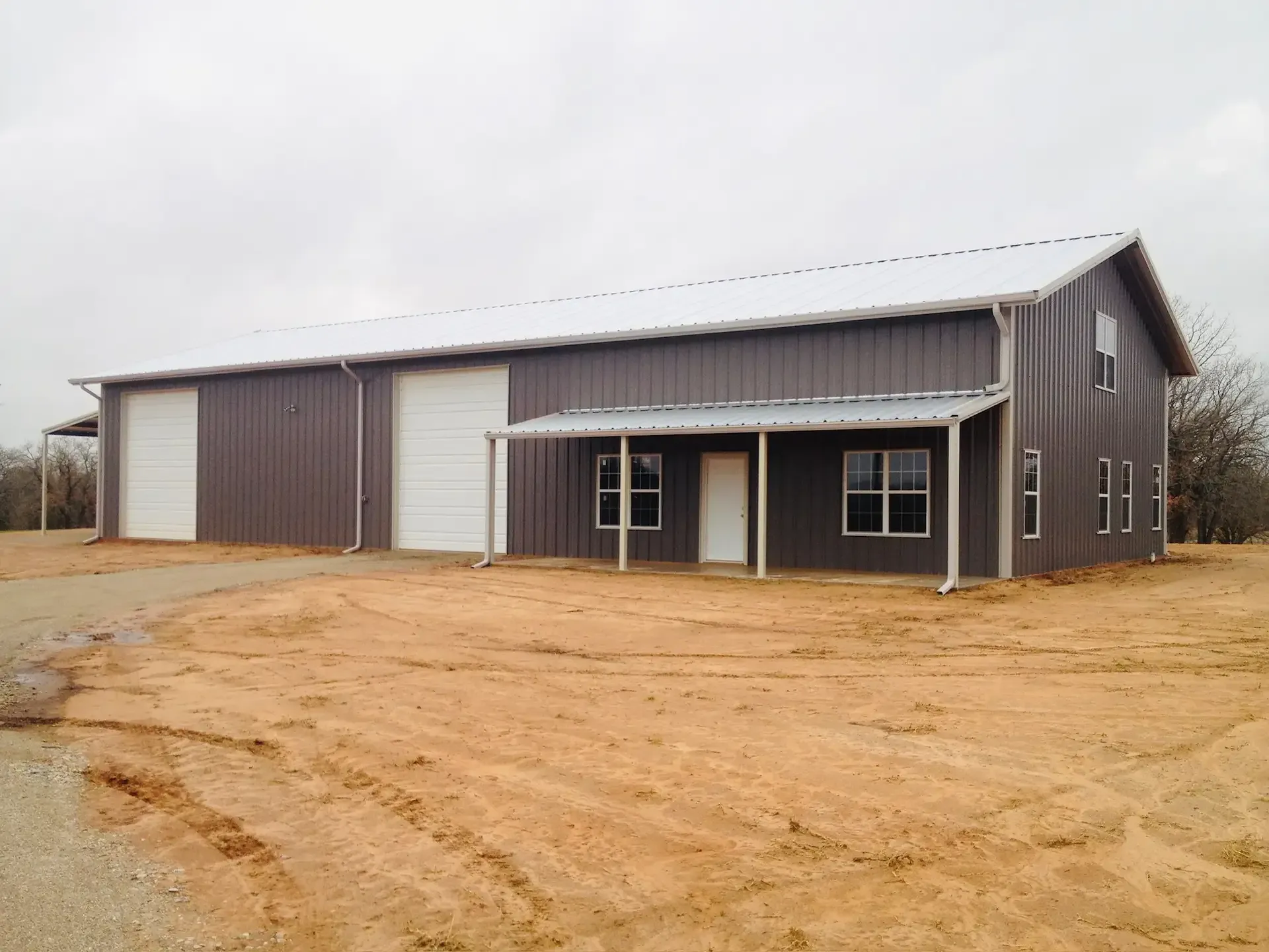 dark gray and white barndominium